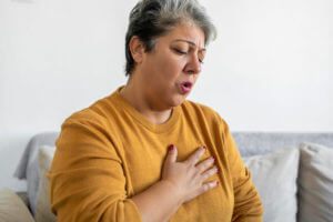 Woman Suffering with Dyspnea