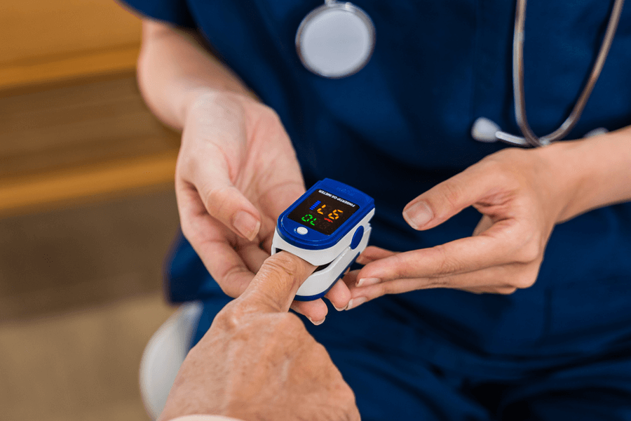 nurse checking blood oxygen
